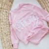 Bluza z napisem Victoria i legginsy prążkowane różowy