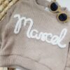 Sweterek z napisem Marcel