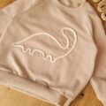 Bluza dziecięca jasny beż z aplikacją dinozaur