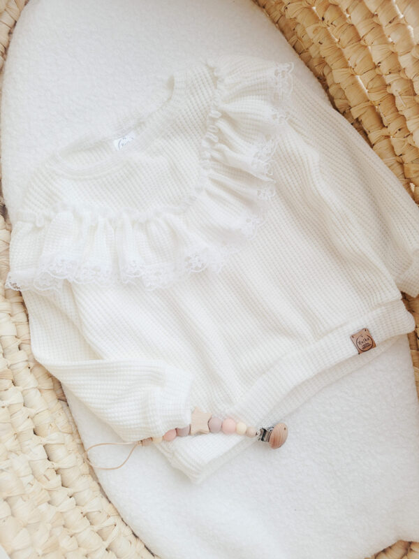 Sweterek dla dziewczynki z falbanką ecru